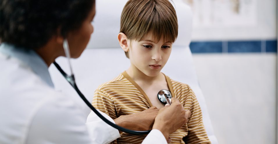 Boy having medical examination by pediatrician