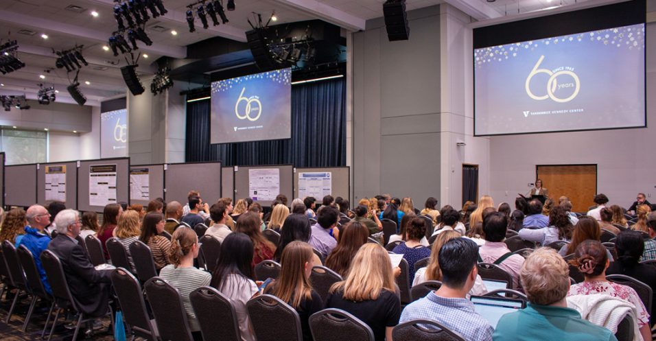 A group of people in a conference room to attend Science Day
